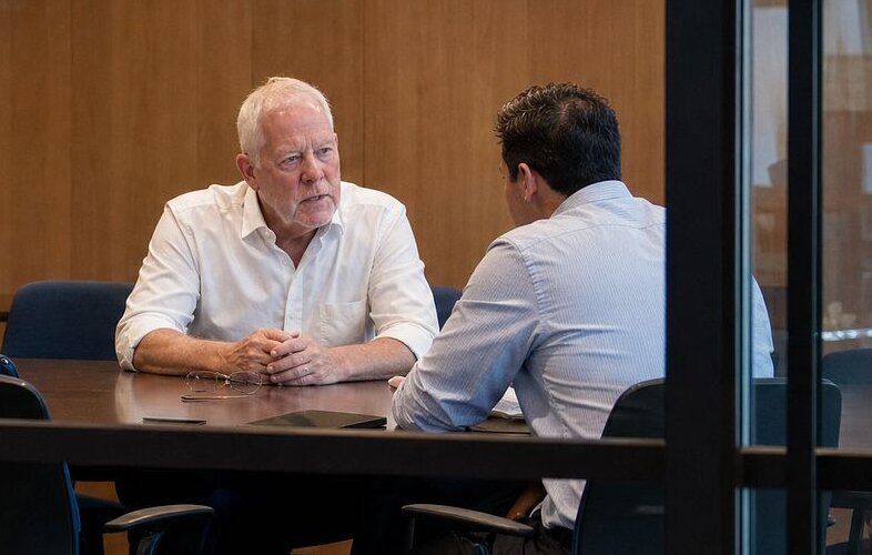 Kevin Crawford in conversation with an executive